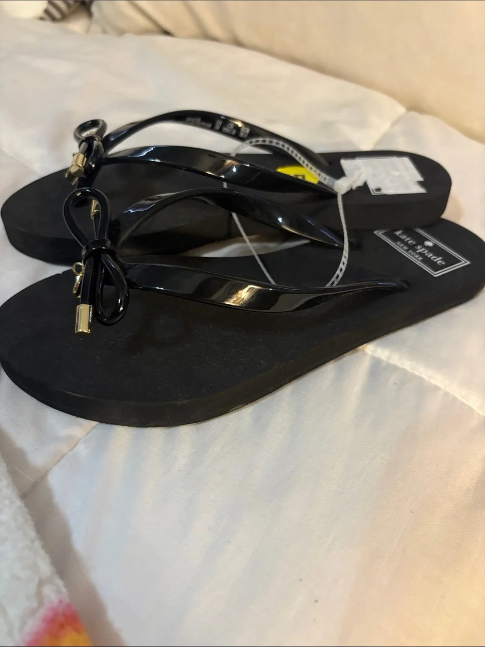 kate spade Black Bow Jelly Flip Flops with Gold Accents